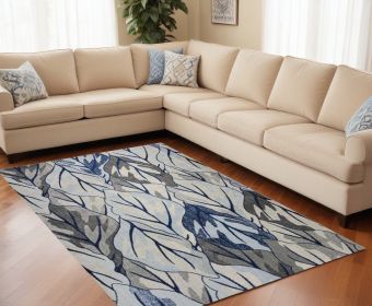 10' X 13' Grey Navy Blue Machine Woven Tropical Leaves Area Rug