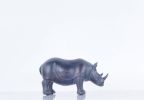 Burnished Bronze And Black Rhinoceros Statue