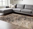 9' X 12' Ivory Beige Machine Woven Distressed Traditional Indoor Area Rug